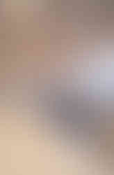 Two glass globe pendant lights shine on the quartz countertop of the center island in Roger's Family Home by Barrett Home Renovations