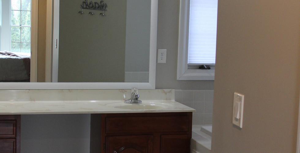 Dated vanity, sconces, faucets, and counter top