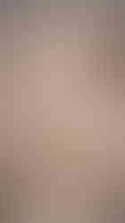 Built-in marble covered shower bench with grab bar in the Mother-In-Law Beach Suite by Barrett Home Renovations