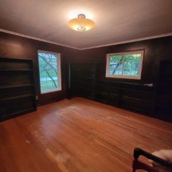 Once dark painted walls and dingy ceiling of former library 