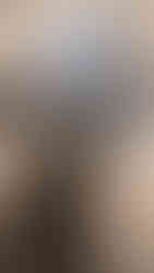 Installed specialty electronic touch-screen above the range with elongated hexagon mosaics on wall