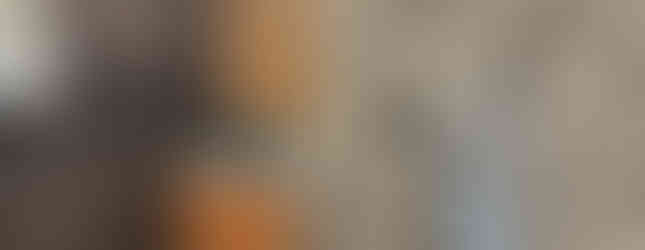 Recessed lighting shines on all stone 3-D tiled wall, and single vessel sink vanity of the Purrfect Bathroom by Barrett Home Renovations