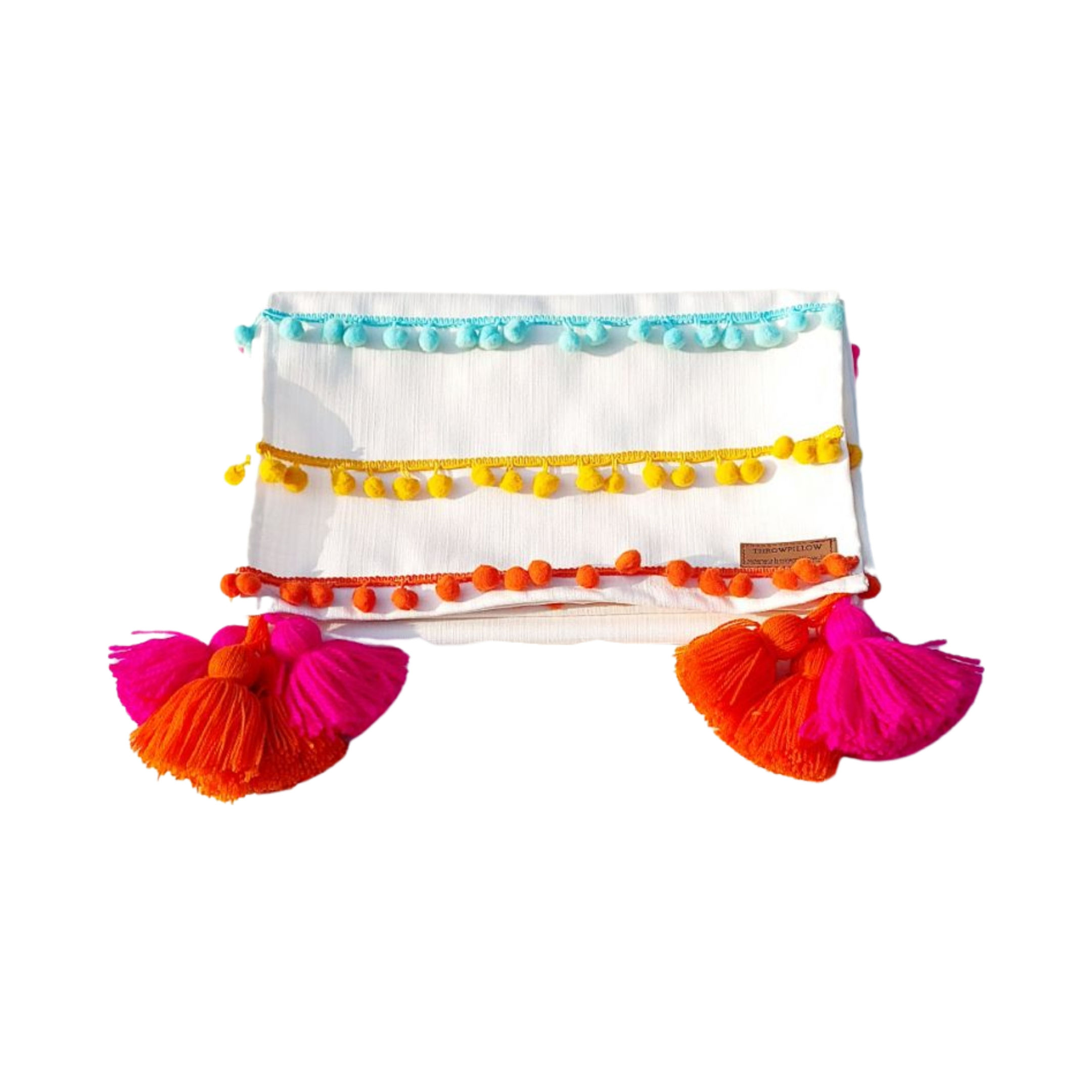 Colorful table runner with intricate pom-pom detailing