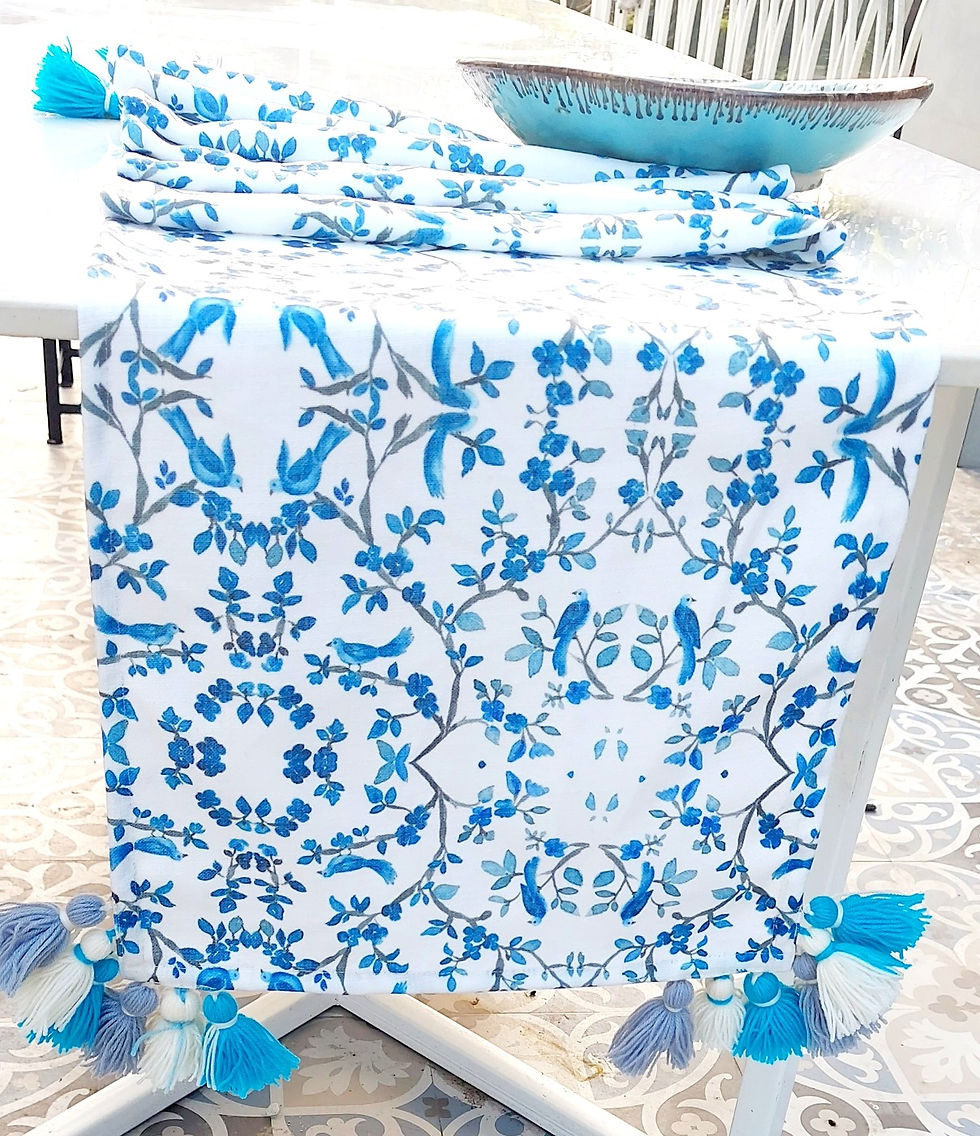 Indexkép: Beautiful white table runner with bird design and blue tassels.