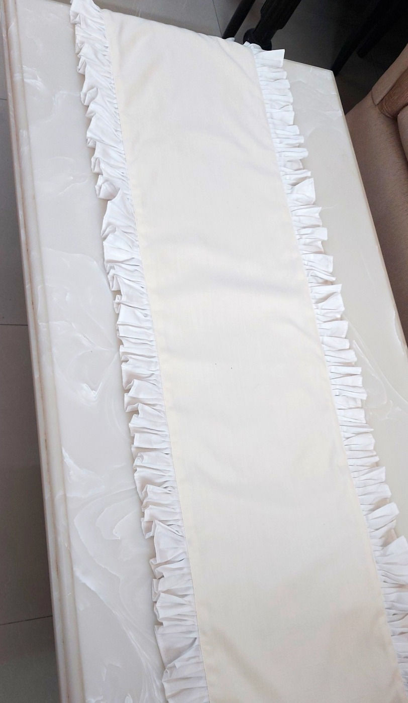Thumbnail: White cotton table runner with frills, perfect for dining tables