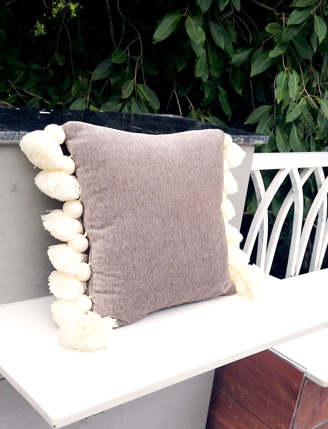 "Close-up of a premium decor fabric grey and white cushion cover"