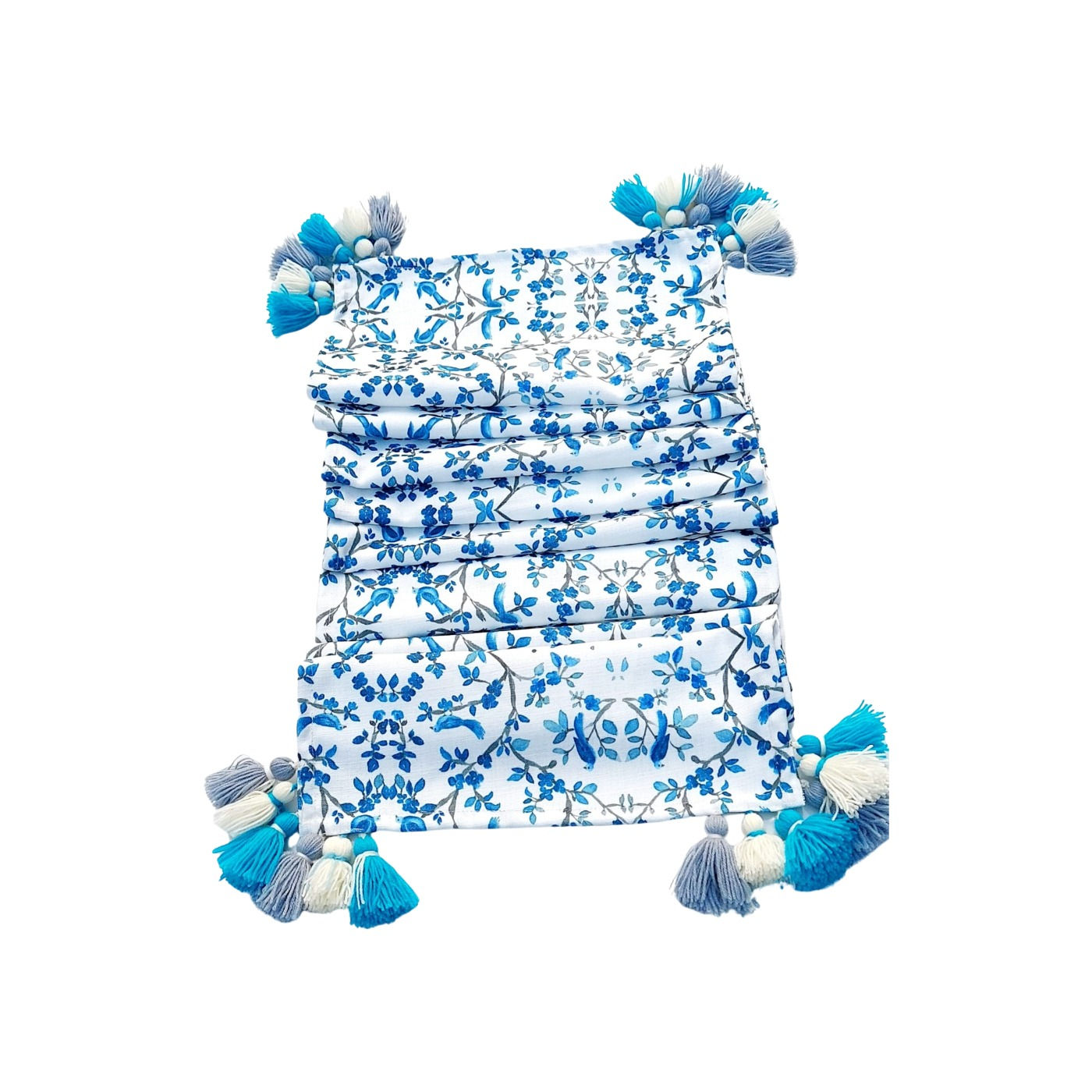 Elegant white table runner with chinoiserie bird print and blue tassels.