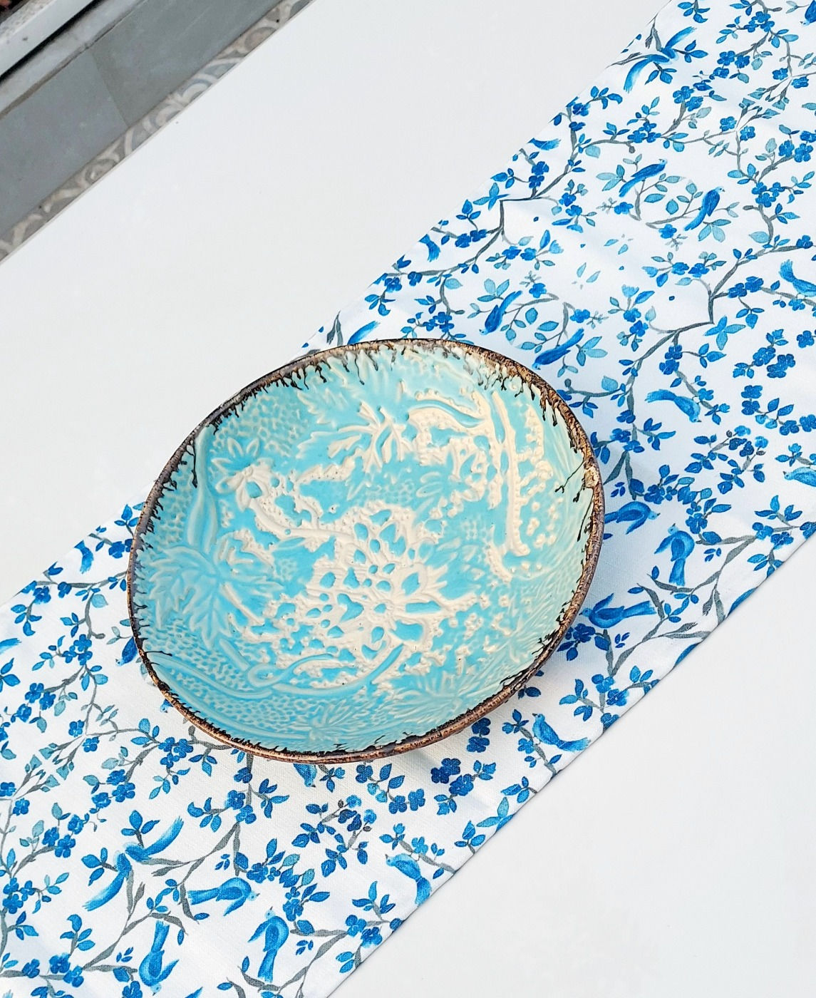 High GSM table runner with intricate bird design and blue tassels