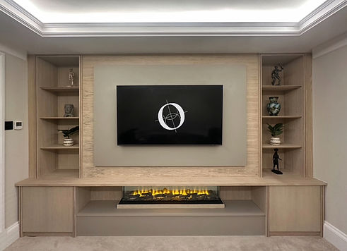 Stylish bespoke media unit with a built-in panoramic fire, seamlessly blending modern design with warmth and functionality