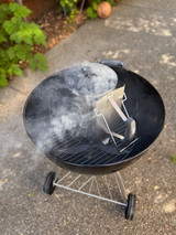 coals will begin to smoke if the fire has caught successfully