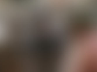 Three black men laughing together in the street