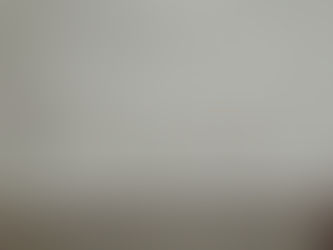 The word "FORGIVE" carved into the pavement