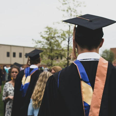 Graduates meeting with family during a graduation ceremony