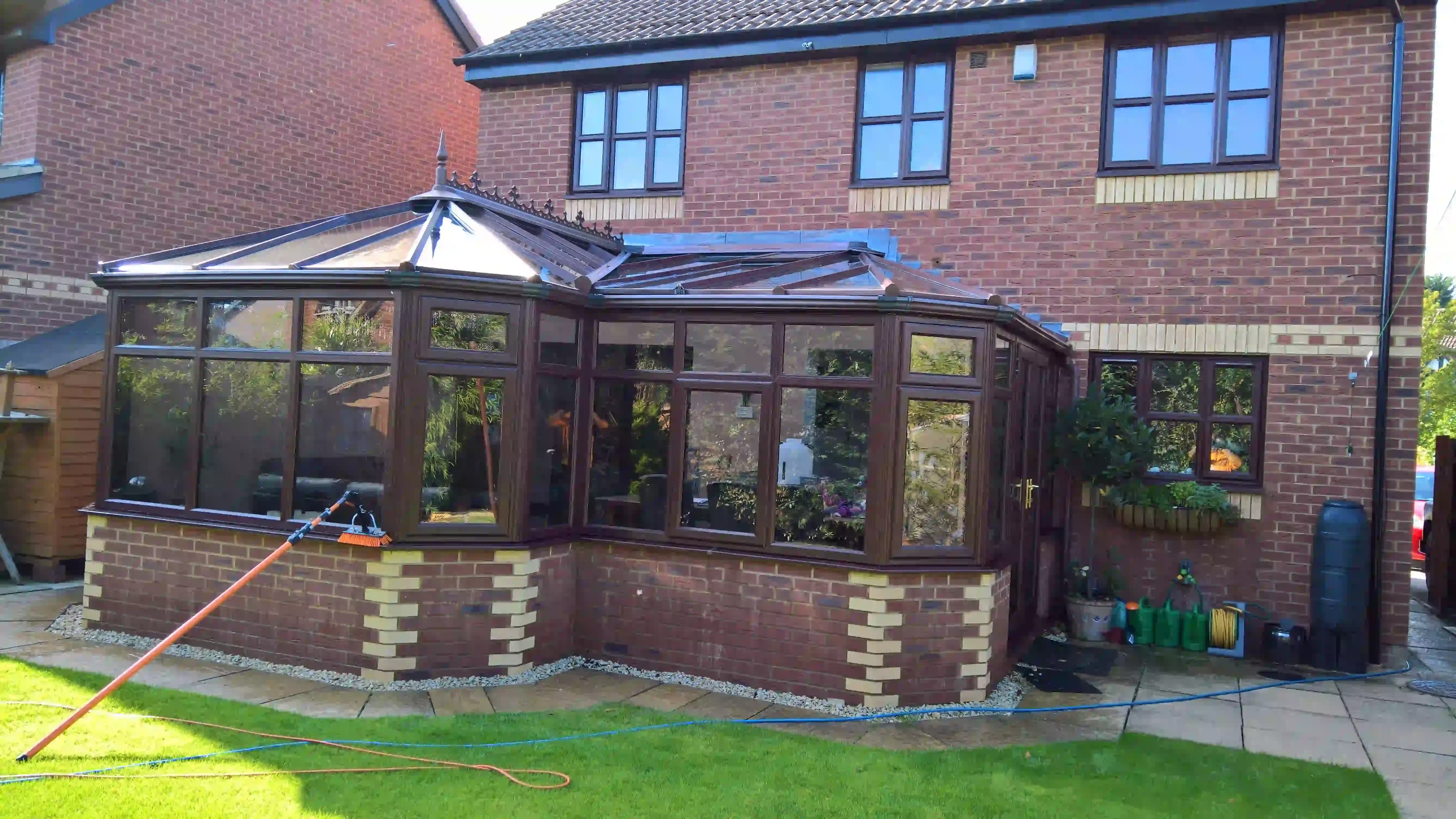 A white UPVC and glass conservatory, sparkling clean after a professional service.