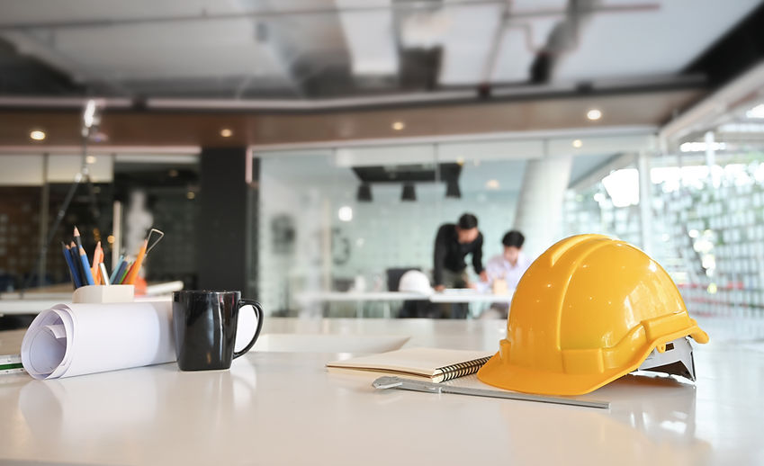 Engineer helmet and drawing equipment Architectural Office desk construction project .jpg