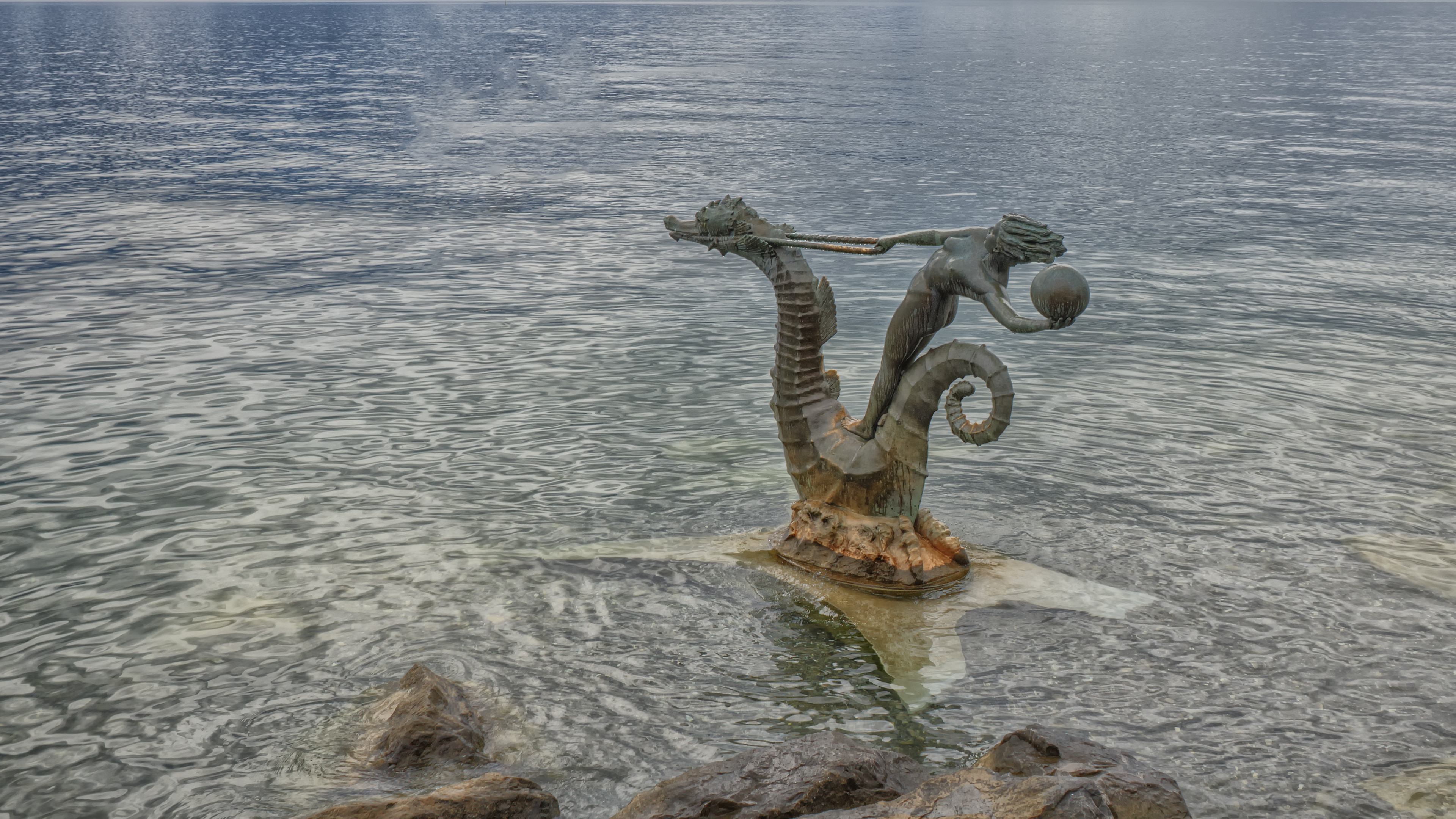 Statue of a woman riding a seahorse