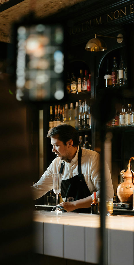 Bar tender preparing for service