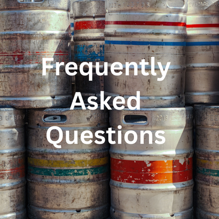 Empty barrels stored on top of each other in a wall of barrels