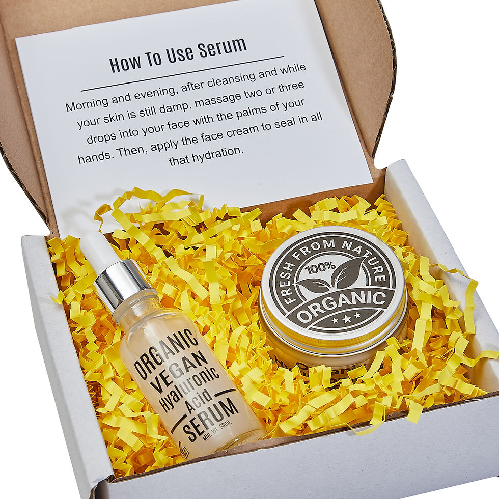 Thumbnail: Organic Hyaluronic Acid Serum and Face Cream in a gift box with yellow shredded paper