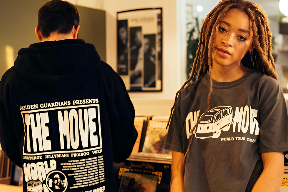 Two people wearing Waaldo’s branded hoodies and T-shirts with bold graphic prints.
