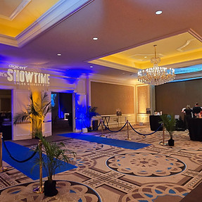 Sleek corporate exhibit kiosk featuring integrated LED video displays and ambient accent uplighting.