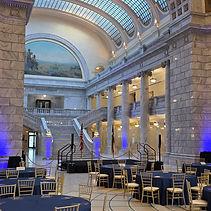 Luxury corporate event ballroom featuring professional staging, custom drape, and AV production in Utah.