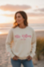 Woman in custom 'Mrs. Williams EST. 2024' sweatshirt on beach