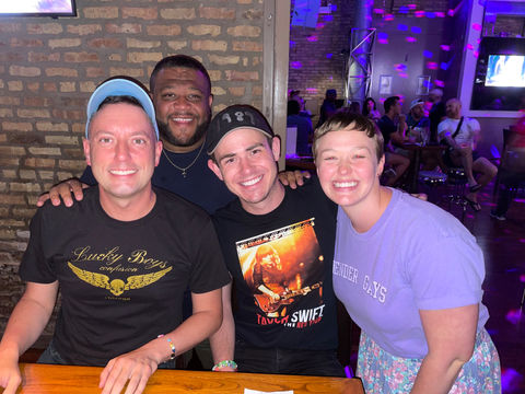 A group of four Stewpendous trivia attendees smiling