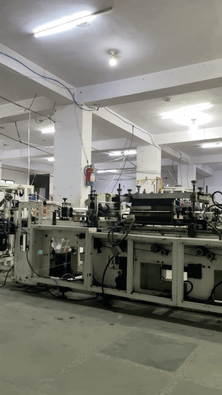 Pouch making and packaging machine