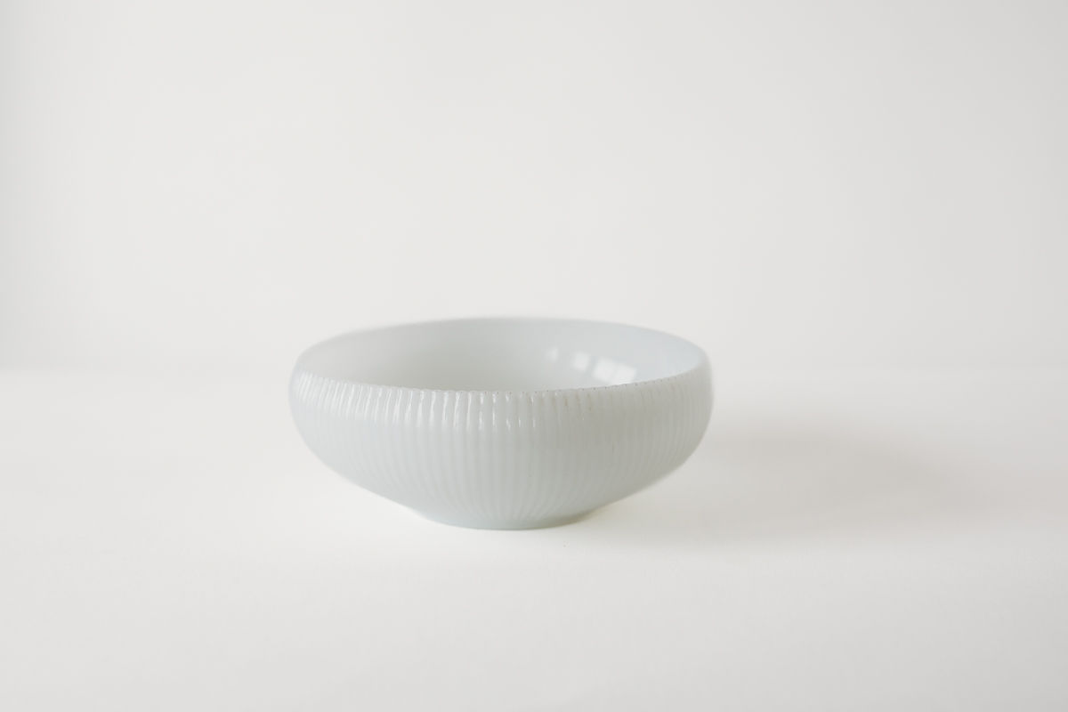 Milk glass ribbed bowl by E.O. Brody Co.