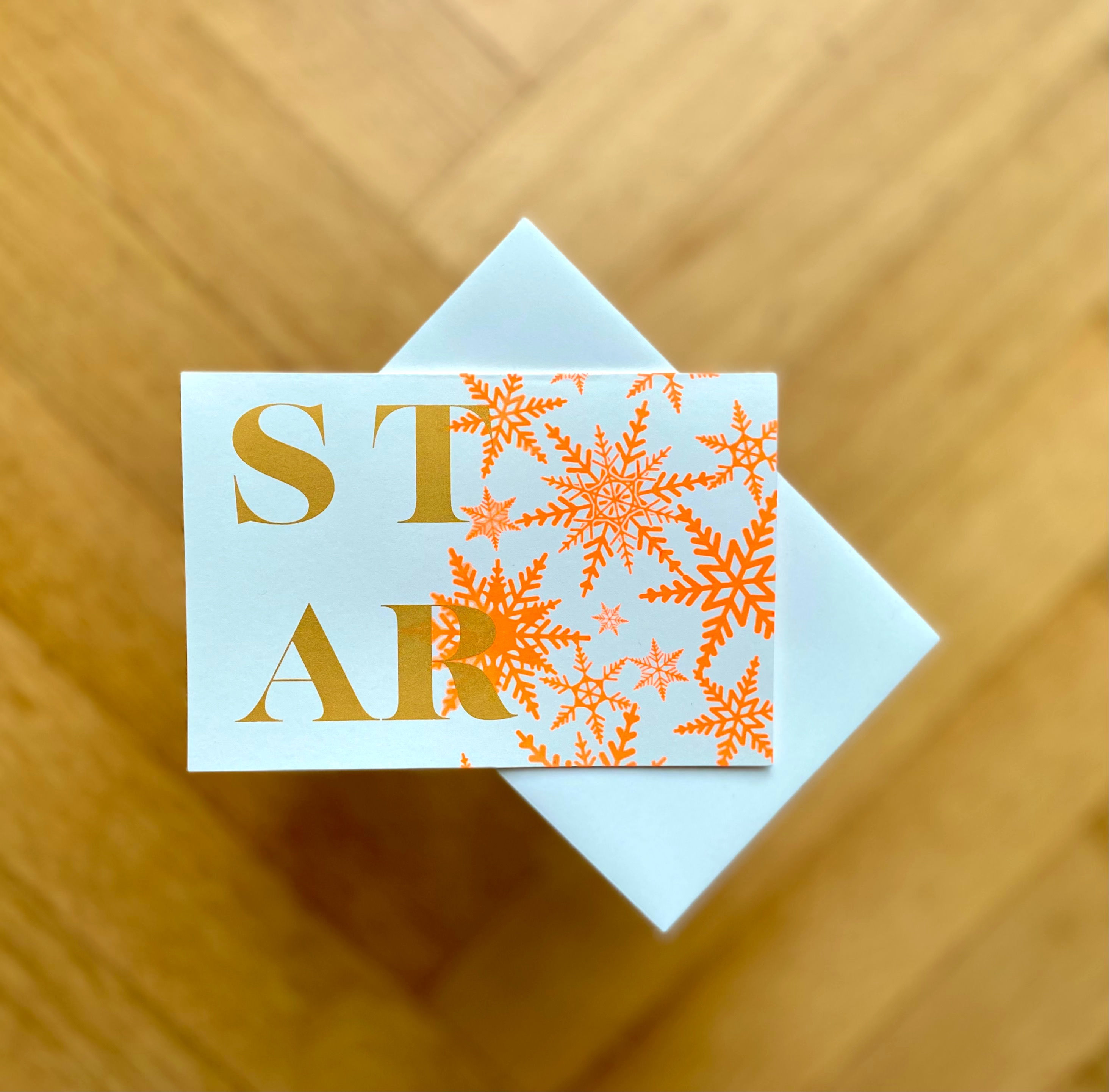 Star on orange snowflakes