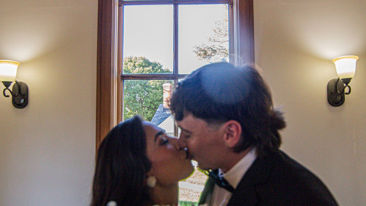 Couple kissing inside chapel interior