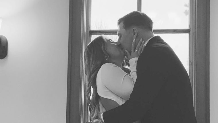 Romantic wedding ceremony inside Kansas small chapel venue