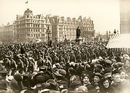 Old picture with a crowd of people from war times. 