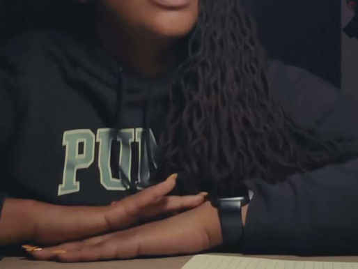 Woman at desk explaining Sandmarc filters