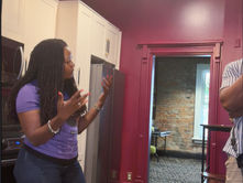 Director Michelle Farley speaks with the director of photography and production sound mixer in the kitchen during a location scout for the short film Chosen. The team discusses camera placement, lighting, and production planning inside the Columbus filming location.