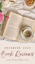 Open book with a teacup holding pink buds on a white cloth. A dessert, teapot, and pink rose are nearby. Text: "December 2025 Book Reviews."