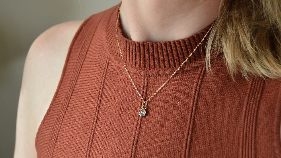 Thumbnail: model wearing rose cut diamond charm in 14k solid gold on thin gold chain