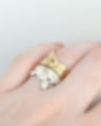 Thumbnail: model wearing reclining nude female figure ring in sterling silver and 14k gold