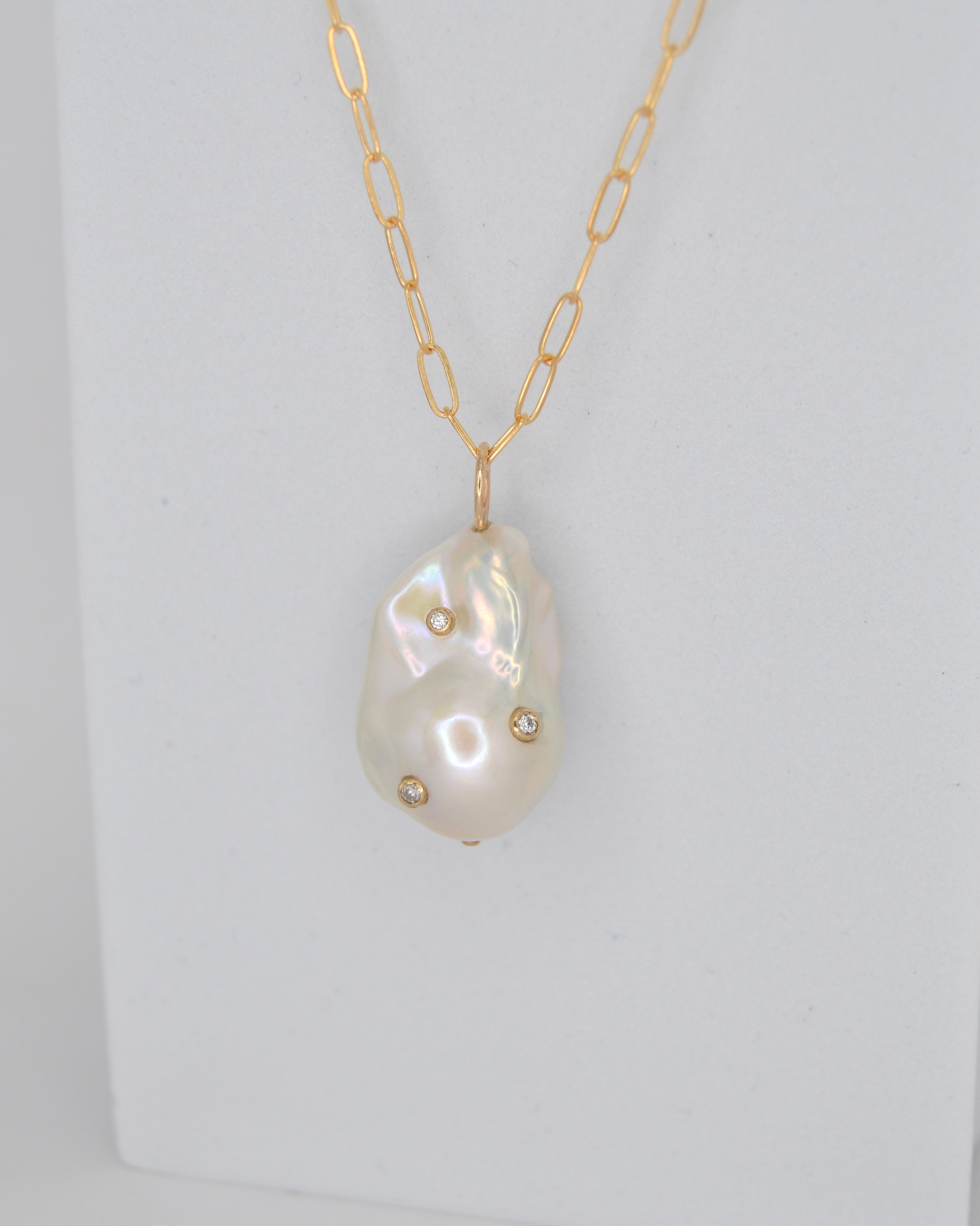 baroque pearl pendant with diamonds on a gold chain