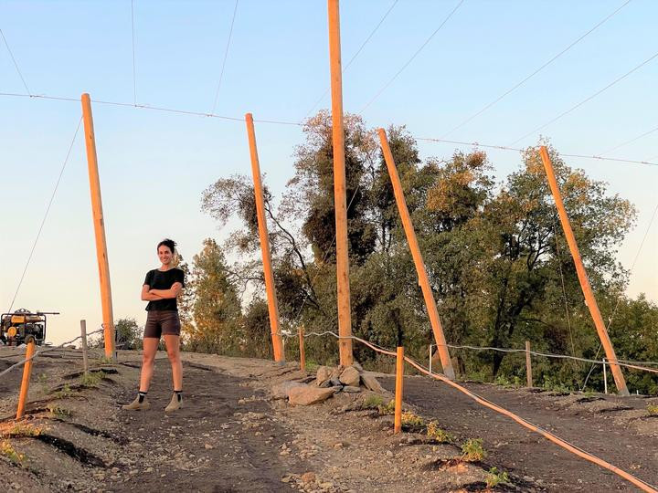 Cassie is standing at the construction site
