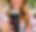 woman holding a tumbler that has _Kylia's Korner LLC_ on it.png