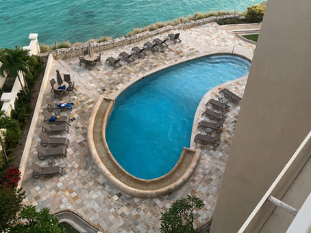 Oceanfront swimming pool at Premium at Rainbow Beach Club in Cupecoy, Sint Maarten, overlooking the Caribbean Sea.