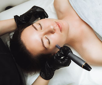 Cosmetic mesotherapy for facial rejuvenation. Cosmetic procedure of microneedling. The cos
