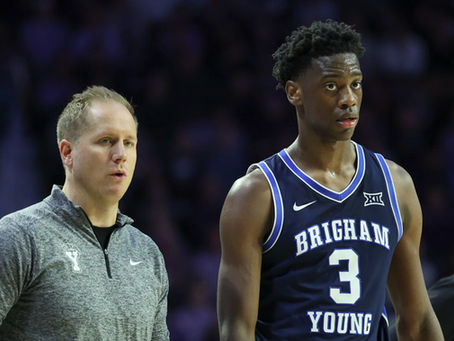 Head coach Kevin Young and star player AJ Dybantsa of the BYU Cougars during a college basketball game.