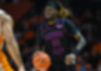 Aaron Nkrumah dribbles the ball for Tennessee State during a college basketball game.
