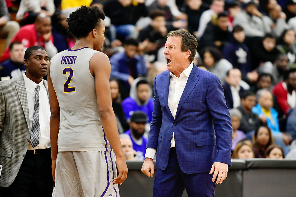 Montverde Academy head coach Kevin Boyle intensely coaching Moses Moody during a game.