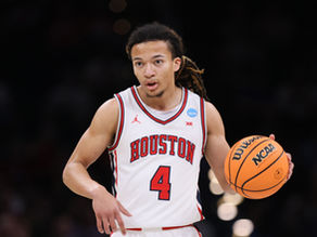 Houston guard Kingston Flemings dribbles the ball during NCAA Tournament action.