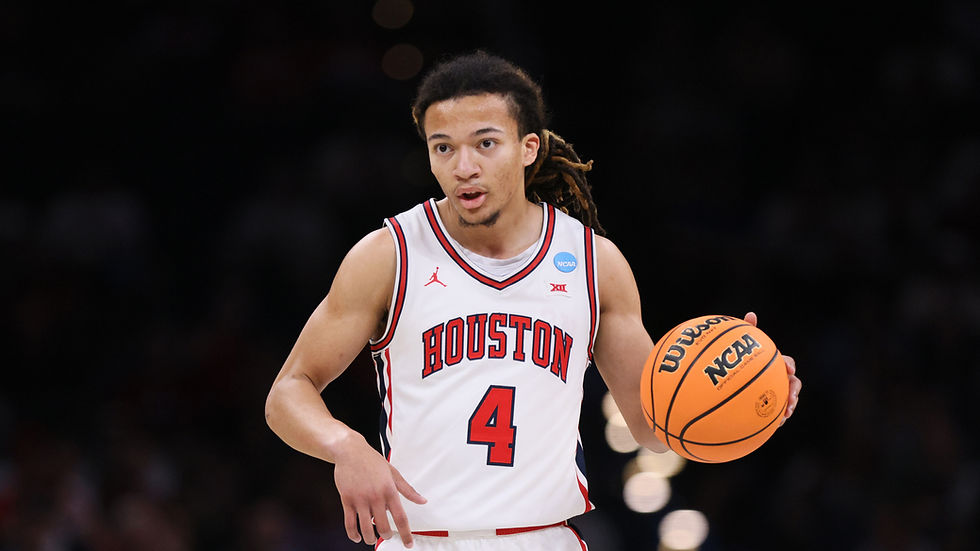 Houston guard Kingston Flemings dribbles the ball during NCAA Tournament action.