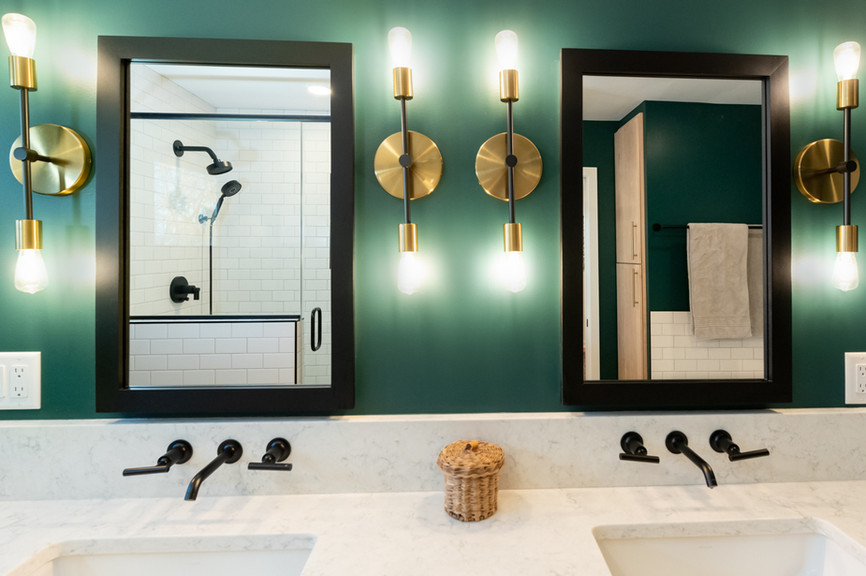 Bathroom remodel, green bathroom walls, double sinks, double mirrors, gold sconces, brass sconces, remodel pictures